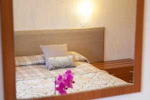 Postel nebo postele na pokoji v ubytování Hotel Fabbrini