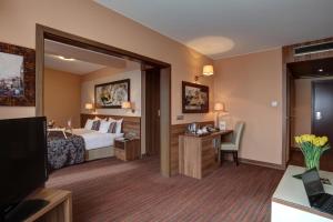 Postel nebo postele na pokoji v ubytování Haston City Hotel + 35 fotografií
