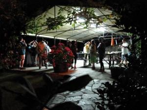 a group of people standing under a tent at Albergue Turístico Valdebaró in Camaleño