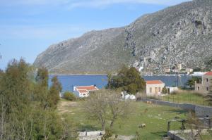 a view of a town and a body of water at "STELIOS & GALINI" in Symi