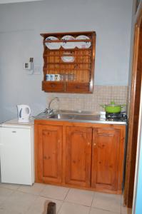 a kitchen with a sink and a counter top at "STELIOS & GALINI" in Symi