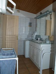 a bathroom with a sink and a mirror at Le Rieufroid in Malaucène