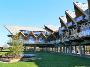 an exterior view of a building with a green yard at Bend in the River Lodge in Stratford-upon-Avon