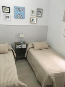 Postel nebo postele na pokoji v ubytování Apartamento Los Naranjos de Santa Justa
