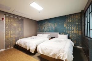 En eller flere senge i et værelse på Hotel Mondavi