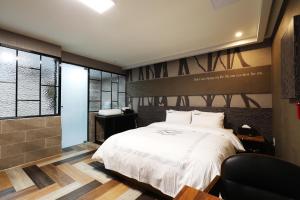 Uma cama ou camas num quarto em Hotel Mondavi