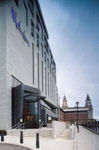 
a large building with a clock on the side of it at Malmaison Liverpool in Liverpool
