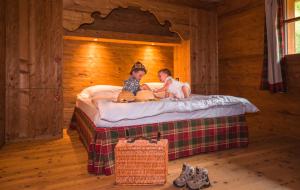 A bed or beds in a room at Ledro Mountain Chalet