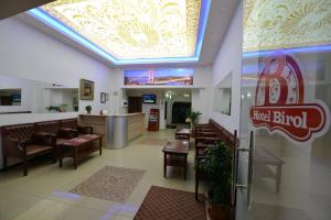 a restaurant with a bar and tables and chairs at Birol Hotel in Istanbul