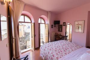 Posteľ alebo postele v izbe v ubytovaní Hotel Pallotta + 37 fotografií