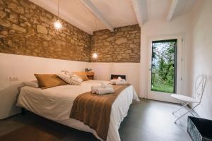 Un pat sau paturi într-o cameră la Sotto I Sassi