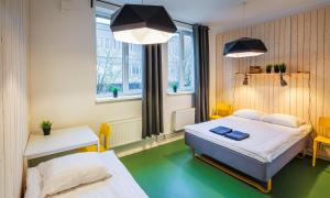 Voodi või voodid majutusasutuse Hektor Design Hostel toas +37 fotot