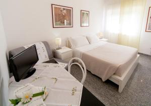 Posteľ alebo postele v izbe v ubytovaní B&B Magna Grecia di Gallitelli