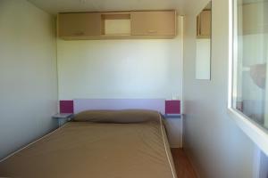 Säng eller sängar i ett rum på Camping El Pasqualet