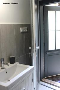 Kúpeľňa v ubytovaní Óváros Apartman + 37 fotografií