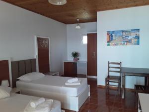Voodi või voodid majutusasutuse Hotel Riviera toas
