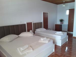 Voodi või voodid majutusasutuse Hotel Riviera toas