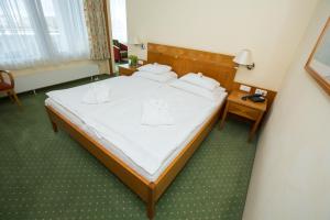 Postel nebo postele na pokoji v ubytování Badener Hof
