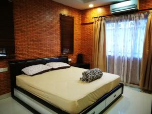 Voodi või voodid majutusasutuse Angel's Penang Homestay toas