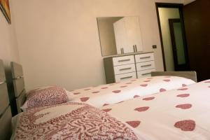 A bed or beds in a room at Appartamenti Giacomo Noventa