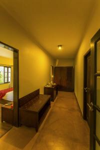 Postel nebo postele na pokoji v ubytování The Windflower Resort & Spa, Coorg
