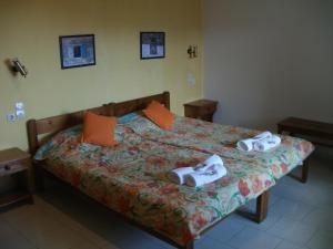 Ένα ή περισσότερα κρεβάτια σε δωμάτιο στο Άλμπατρος