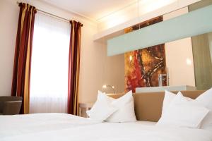 Postel nebo postele na pokoji v ubytování Hotel Seehof