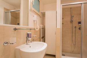 a bathroom with a sink and a shower at Wally Residence in Rimini