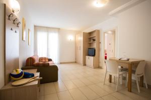 a living room with a couch and a table at Wally Residence in Rimini