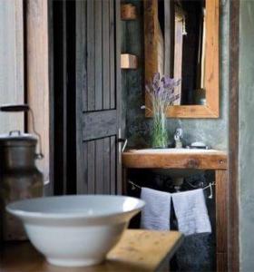 a bathroom with a sink and a white bowl at Posada de San Antonio in La Pedrera