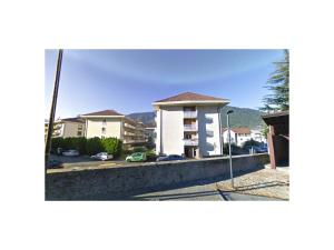 a view of a building with a parking lot at Apartments Sissi & Franz in Merano
