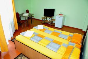 Postel nebo postele na pokoji v ubytování Casa Otilia + 7 fotografií