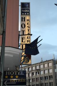 a hotel sign on the side of a building at Yasha Hotel in Luxembourg
