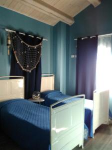 Postel nebo postele na pokoji v ubytování Quattro Stagioni + 16 fotografií