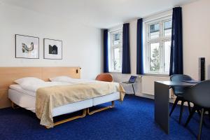 Voodi või voodid majutusasutuse Herning City Hotel toas