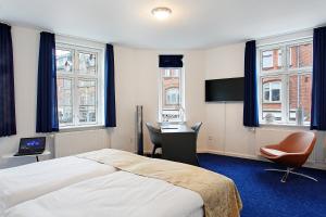 Voodi või voodid majutusasutuse Herning City Hotel toas
