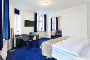 Voodi või voodid majutusasutuse Herning City Hotel toas