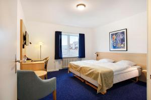 Voodi või voodid majutusasutuse Herning City Hotel toas