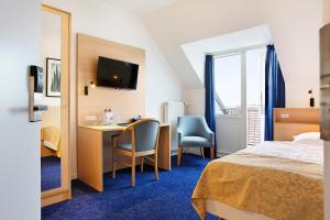 Voodi või voodid majutusasutuse Herning City Hotel toas