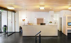 an office with a reception desk and a counter at Herning City Hotel in Herning