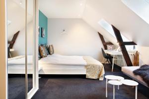 Voodi või voodid majutusasutuse Herning City Hotel toas