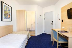 Voodi või voodid majutusasutuse Herning City Hotel toas