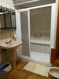 a bathroom with a shower and a sink at Casa Mar Azul in Arinaga