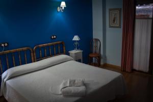 Postel nebo postele na pokoji v ubytování Casa Rural Teresa