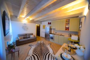 a zebra laying on the floor of a living room at Appartamenti Volta in Como