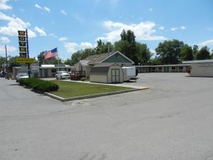 a parking lot in front of a motel at Paintbrush Motel in Riverton