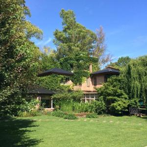 a large brick house with a lawn in front of it at La Ignacia Bed and Breakfast in Pilar