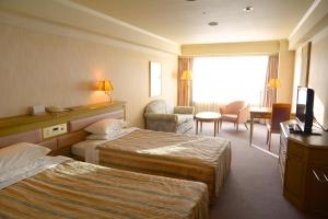 Un ou plusieurs lits dans un hébergement de l'établissement Hotel Listel Inawashiro Wing Tower