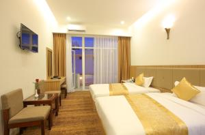 Letto o letti in una camera di Red Palace Hotel