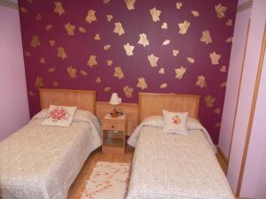 Cama ou camas em um quarto em O Lar de Carmiña